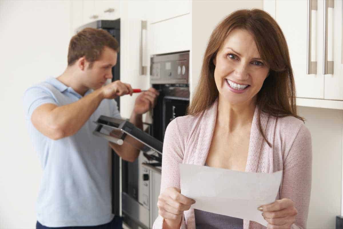 Image of happy homeowner receiving appliance repair in Colorado Springs.
